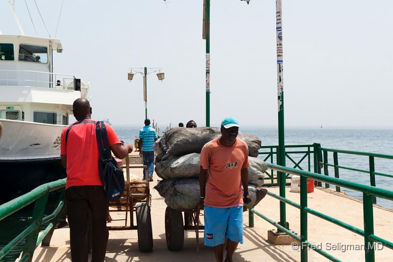 20090528_115054 D3 P1 P1.jpg - Workman on dock, Goree Island